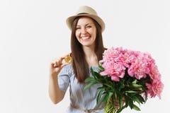 Young woman in dress, hat holding bitcoin, coin of golden color, bouquet of beautiful pink peonies flowers isolated on stock image Young woman in dress, hat holding bitcoin, coin of golden color, bouquet of beautiful pink peonies flowers isolated on stock image