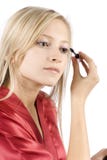 Young Woman Dressed Red Bathrobe Putting Mascara Stock Image