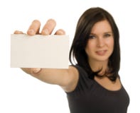 Young Woman Holding A Blank Business Card Royalty Free Stock Images