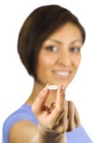 Young Woman Holds A White Pill. Stock Photography