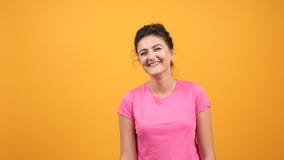 Young Woman In Pink T-shirt Smiling And Laughing Hard With Natural Emotions Royalty Free Stock Photos