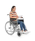Young Woman In Wheelchair Using Tablet Stock Photo