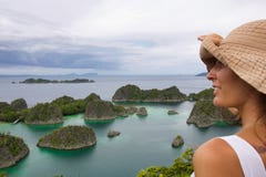 Young woman looking typical landscape of papua island stock photo Young woman looking typical landscape of papua island stock photo