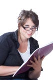 Young woman looks up from her planner Stock Image Young woman looks up from her planner Stock Image