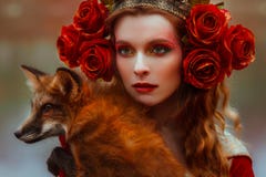 Woman in medieval clothes with a fox royalty free stock photography Woman in medieval clothes with a fox royalty free stock photography