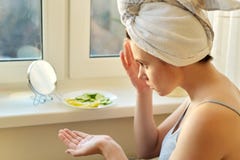 Young Woman Near Home Window Looking In Mirror, Applying Face Cream Royalty Free Stock Photo Young Woman Near Home Window Looking In Mirror, Applying Face Cream Royalty Free Stock Photo