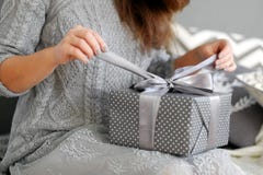 Young woman opens the box with a Christmas present stock images Young woman opens the box with a Christmas present stock images
