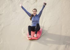 Young Woman Playing in the Sand Dunes Outdoor Lifestyle royalty free stock images Young Woman Playing in the Sand Dunes Outdoor Lifestyle royalty free stock images
