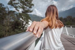 Young woman posing on an architectural bridge stock photo Young woman posing on an architectural bridge stock photo