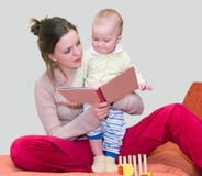 Young Woman Reading Book With Kid Royalty Free Stock Image