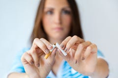 Young Woman Refuses To Smoke And Breaks Cigarette. Stock Photos Young Woman Refuses To Smoke And Breaks Cigarette. Stock Photos