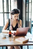 Young woman sitting in coffee shop royalty free stock photos Young woman sitting in coffee shop royalty free stock photos
