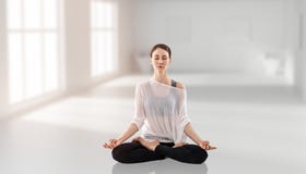 Young Woman Sitting In A Lotus Position. 3d Rendering. Stock Photography