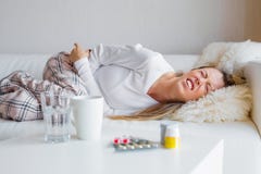 Woman suffering from abdominal pain Royalty Free Stock Images Woman suffering from abdominal pain Royalty Free Stock Images