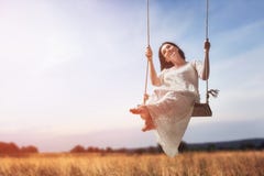 Young woman on a swing Royalty Free Stock Image Young woman on a swing Royalty Free Stock Image