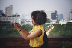 Young woman taking a photo in the cityscape royalty free stock images Young woman taking a photo in the cityscape royalty free stock images