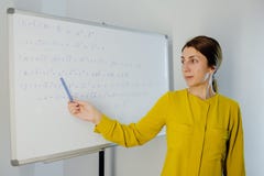 Young woman teacher working from home teach online math subject
