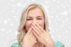 Young woman or teenage girl closing her nose Royalty Free Stock Photos Young woman or teenage girl closing her nose Royalty Free Stock Photos