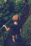 Young woman tourist in the deep rainforest of Bali island, close to waterfall. Indonesia. royalty free stock images Young woman tourist in the deep rainforest of Bali island, close to waterfall. Indonesia. royalty free stock images