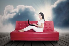 https://thumbs.dreamstime.com/t/young-woman-using-laptop-sofa-shot-outdoors-under-cloudy-day-36675354.jpg