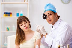 The young woman visting male doctor otolaryngologist royalty free stock images The young woman visting male doctor otolaryngologist royalty free stock images