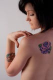 Young Woman With Bare Back And Tattoo Stock Image