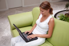 Young Woman Working On A Laptop Stock Image