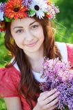Young woman with wreath and with lilac flowers in springtime Royalty Free Stock Photo Young woman with wreath and with lilac flowers in springtime Royalty Free Stock Photo