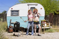 Young Women In Front Of A Trailer Royalty Free Stock Photo