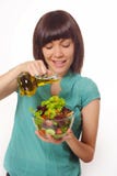 Young women making salad on white background stock photography Young women making salad on white background stock photography