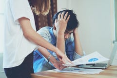 Young women are scolding employees who work late at work, Causing damage. royalty free stock image Young women are scolding employees who work late at work, Causing damage. royalty free stock image