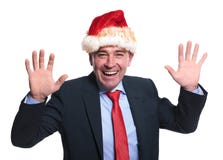 Z podnieceniem dojrzały biznesowy mężczyzna jest ubranym Santa Claus kapelusz zdjęcia royalty free Z podnieceniem dojrzały biznesowy mężczyzna jest ubranym Santa Claus kapelusz zdjęcia royalty free