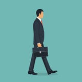 Zakenman die met aktentas aan het werk lopen royalty-vrije illustratie Zakenman die met aktentas aan het werk lopen royalty-vrije illustratie