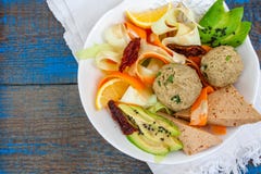 Zucchini pasta with tofu lentil balls, avocado, carrots. stock photo Zucchini pasta with tofu lentil balls, avocado, carrots. stock photo