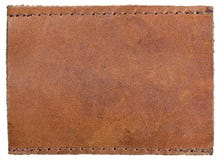 Étiquette granuleuse naturelle vide vide brun-rougeâtre de jeans de label de cuir de texture, grand macro horizontal texturisé d' Photo libre de droits Étiquette granuleuse naturelle vide vide brun-rougeâtre de jeans de label de cuir de texture, grand macro horizontal texturisé d' Photo libre de droits