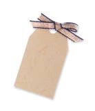 Étiquette jaune de cadeau attachée avec la bande (chemin de découpage y compris) photos libres de droits Étiquette jaune de cadeau attachée avec la bande (chemin de découpage y compris) photos libres de droits