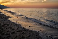 Пляж Mer sur Villers на заходе солнца стоковое фото Пляж Mer sur Villers на заходе солнца стоковое фото