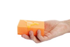 Тензид на washcloth в руке изолированной на белой предпосылке стоковая фотография Тензид на washcloth в руке изолированной на белой предпосылке стоковая фотография
