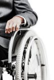 Άκυρος ή με ειδικές ανάγκες επιχειρηματίας στη μαύρη αναπηρική καρέκλα συνεδρίασης κοστουμιών στοκ φωτογραφία με δικαίωμα ελεύθερης χρήσης Άκυρος ή με ειδικές ανάγκες επιχειρηματίας στη μαύρη αναπηρική καρέκλα συνεδρίασης κοστουμιών στοκ φωτογραφία με δικαίωμα ελεύθερης χρήσης