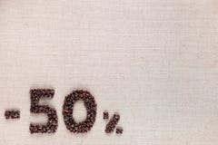50% έκπτωση από το ευθυγραμμισμένο κατώτατο σημείο φασολιών καφέ που αφήνεται στοκ φωτογραφία με δικαίωμα ελεύθερης χρήσης 50% έκπτωση από το ευθυγραμμισμένο κατώτατο σημείο φασολιών καφέ που αφήνεται στοκ φωτογραφία με δικαίωμα ελεύθερης χρήσης