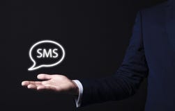 Εικονίδιο Sms στο χέρι επιχειρηματιών στοκ εικόνες με δικαίωμα ελεύθερης χρήσης Εικονίδιο Sms στο χέρι επιχειρηματιών στοκ εικόνες με δικαίωμα ελεύθερης χρήσης