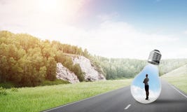 Επιχειρηματίας μέσα στη λάμπα φωτός Στοκ Εικόνα Επιχειρηματίας μέσα στη λάμπα φωτός Στοκ Εικόνα