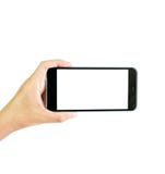 Κενή οθόνη smartphone εκμετάλλευσης χεριών, πορεία ψαλιδίσματος στοκ εικόνα Κενή οθόνη smartphone εκμετάλλευσης χεριών, πορεία ψαλιδίσματος στοκ εικόνα