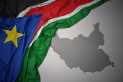 Κυματίζοντας ζωηρόχρωμοι εθνική σημαία και χάρτης του Νότιου Σουδάν διανυσματική απεικόνιση Κυματίζοντας ζωηρόχρωμοι εθνική σημαία και χάρτης του Νότιου Σουδάν διανυσματική απεικόνιση