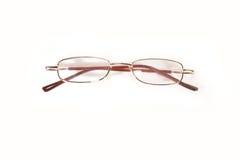 Μικρά μεταλλικά eyeglasses που απομονώνονται στοκ εικόνες Μικρά μεταλλικά eyeglasses που απομονώνονται στοκ εικόνες
