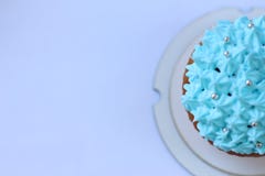Μπλε κρέμα cupcake, έννοια γενεθλίων στοκ φωτογραφίες με δικαίωμα ελεύθερης χρήσης Μπλε κρέμα cupcake, έννοια γενεθλίων στοκ φωτογραφίες με δικαίωμα ελεύθερης χρήσης