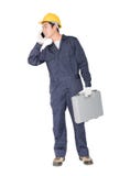Νέα handyman στάση με το κιβώτιο εργαλείων του στοκ φωτογραφίες Νέα handyman στάση με το κιβώτιο εργαλείων του στοκ φωτογραφίες
