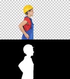 Νέα γυναίκα κίτρινο hardhat που περπατά, άλφα κανάλι στοκ φωτογραφίες Νέα γυναίκα κίτρινο hardhat που περπατά, άλφα κανάλι στοκ φωτογραφίες