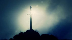 Ξίφος Excalibur που κολλιέται σε έναν βράχο Ξίφος Excalibur που κολλιέται σε έναν βράχο