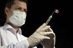 Ο νεαρός άνδρας ως γιατρός δίνει μια ιατρική έγχυση στη μεξικάνικη σημαία σε ένα μαύρο υπόβαθρο στοκ εικόνα Ο νεαρός άνδρας ως γιατρός δίνει μια ιατρική έγχυση στη μεξικάνικη σημαία σε ένα μαύρο υπόβαθρο στοκ εικόνα